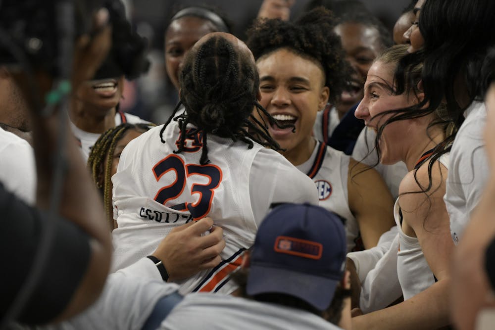 Auburn celebrates their win against LSU on January 14th 2024 at Neville Arena
