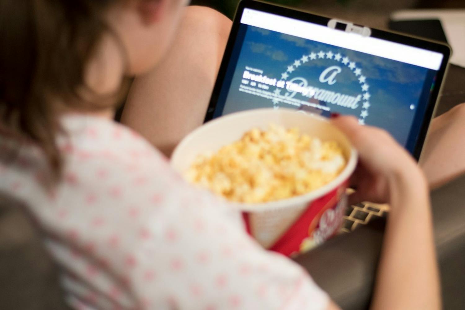 A student watches a movie on Netflix with a bowl of popcorn on Monday, Feb. 5, 2018, in Auburn, Ala.