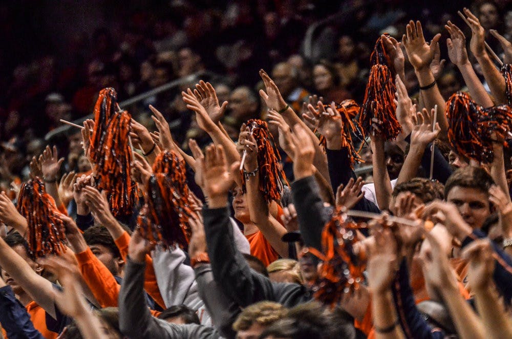 Students cheer after a freethrow is made. (Raye May | Photo Editor)