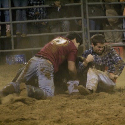 Slay Huff, junior in finance, and Trevor Ramsey, undeclared junior in sciences and math, wrestle a bull to the ground in the 2009 FarmHouse Rodeo. (CONTRIBUTED)