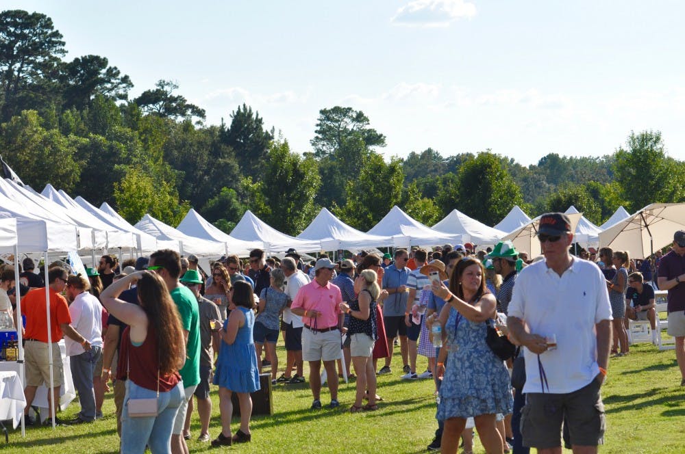 Guests crowd around tents for Oktoberfest on Saturday, Oct. 6, 2018 in Auburn, Ala.