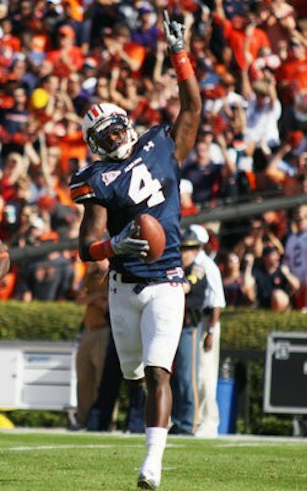 Etheridge celebrates an interception against LSU in 2010.
