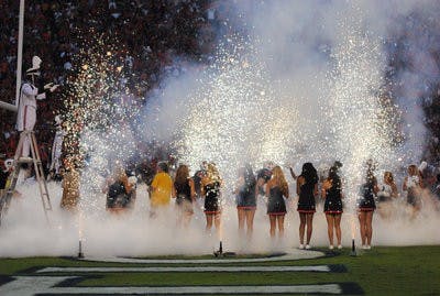 Fog machines and sparks highlight the Tigers' run out of the tunnel prior to the Florida game in Jordan-Hare Stadium. (Maria Iampietro / PHOTO EDITOR)