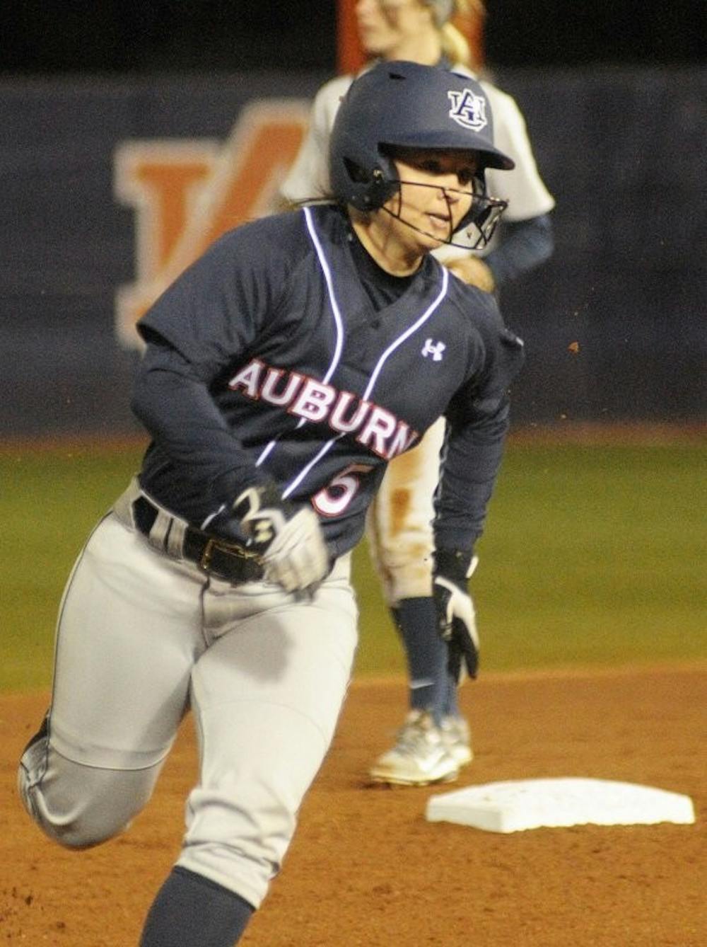 Emily Carosone #5 rounds second base and speeds to third. Auburn vs George Washington in Auburn, AL on Feb. 7, 2015. Adam Sparks | Photographer