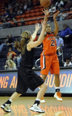 Auburn's Chadarryl Clay shoots from the outside over Missouri's Morgan Eye in the first half of their college women's basketball game on Sunday, February 24. (Courtesy of Todd Van Emst)