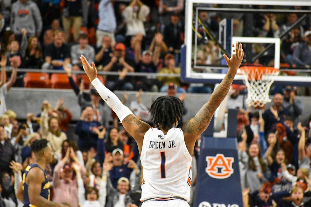 December 22, 2021; Auburn, Alabama; Wendell Green Jr. (1) celebrates after draining a half-court shot in a match between Auburn and Murray State in the Auburn Arena.