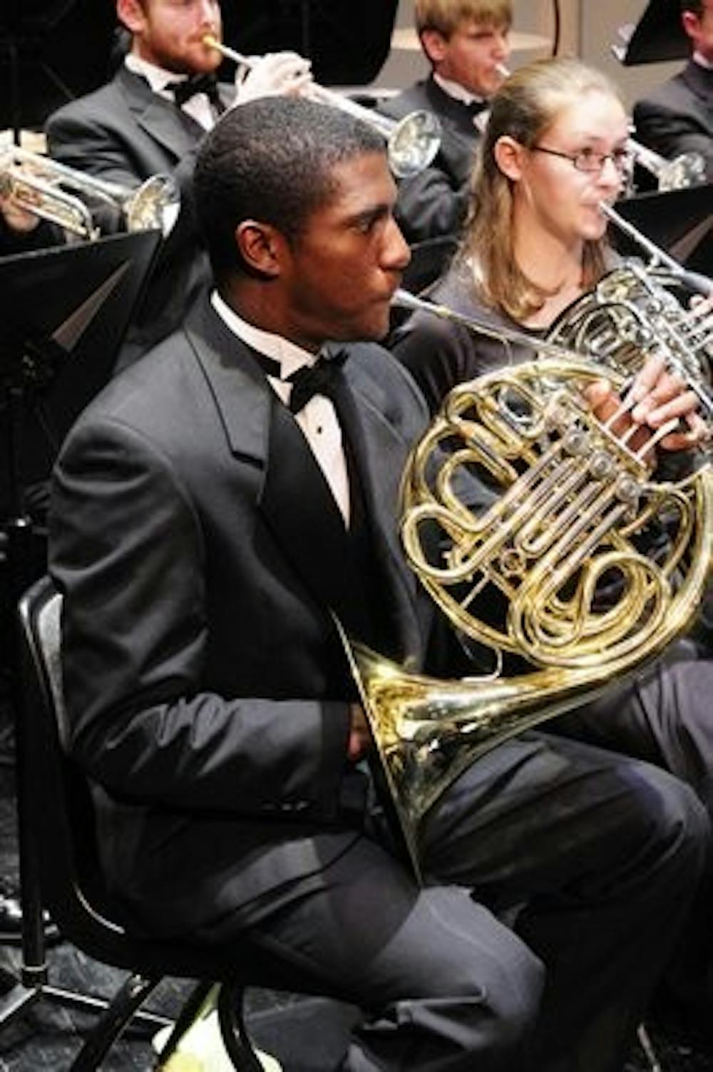 Daniel Johnson, member of The Auburn University Band, plays his french horn during the benefit concert in memory of Sarah Anderson.