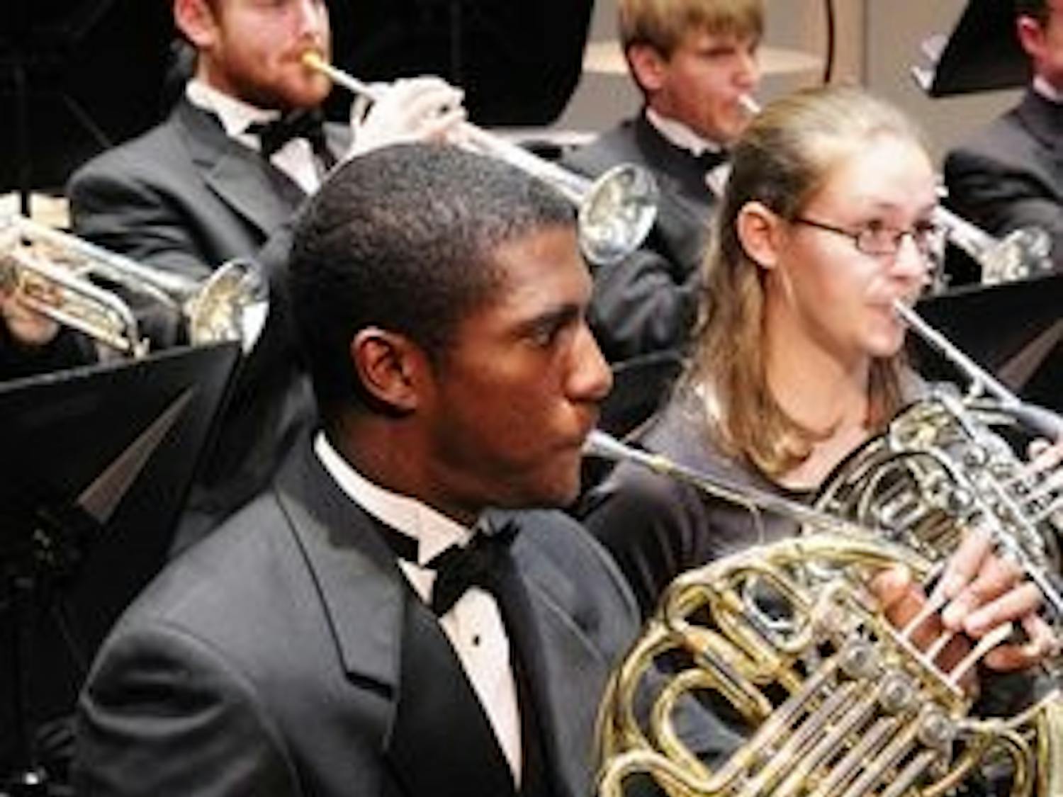 Daniel Johnson, member of The Auburn University Band, plays his french horn during the benefit concert in memory of Sarah Anderson.