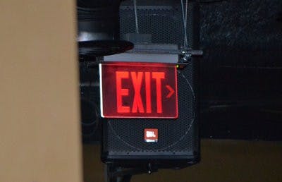 The International Building Code states that exits must be clearly marked by an approved exit sign. Violations can result in hefty fines. (Raye May / PHOTO EDITOR)