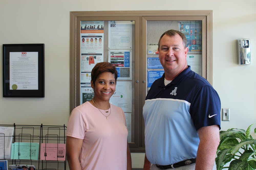 <p>Auburn Junior High School teacher Kimberly Johnson, left, stands with Ross Reed, principal of the school. Johnson was announced as one of four finalists of the Alabama Teacher of the Year Award on Wednesday, June 17, 2021.</p>