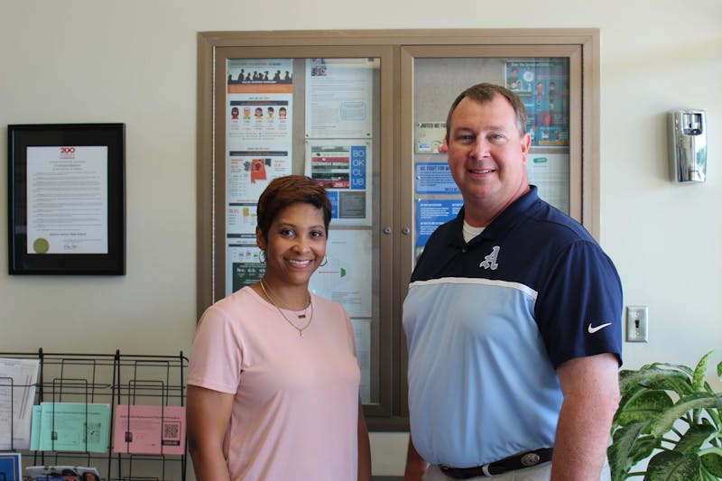 Auburn Junior High School teacher Kimberly Johnson, left, stands with Ross Reed, principal of the school. Johnson was announced as one of four finalists of the Alabama Teacher of the Year Award on Wednesday, June 17, 2021.