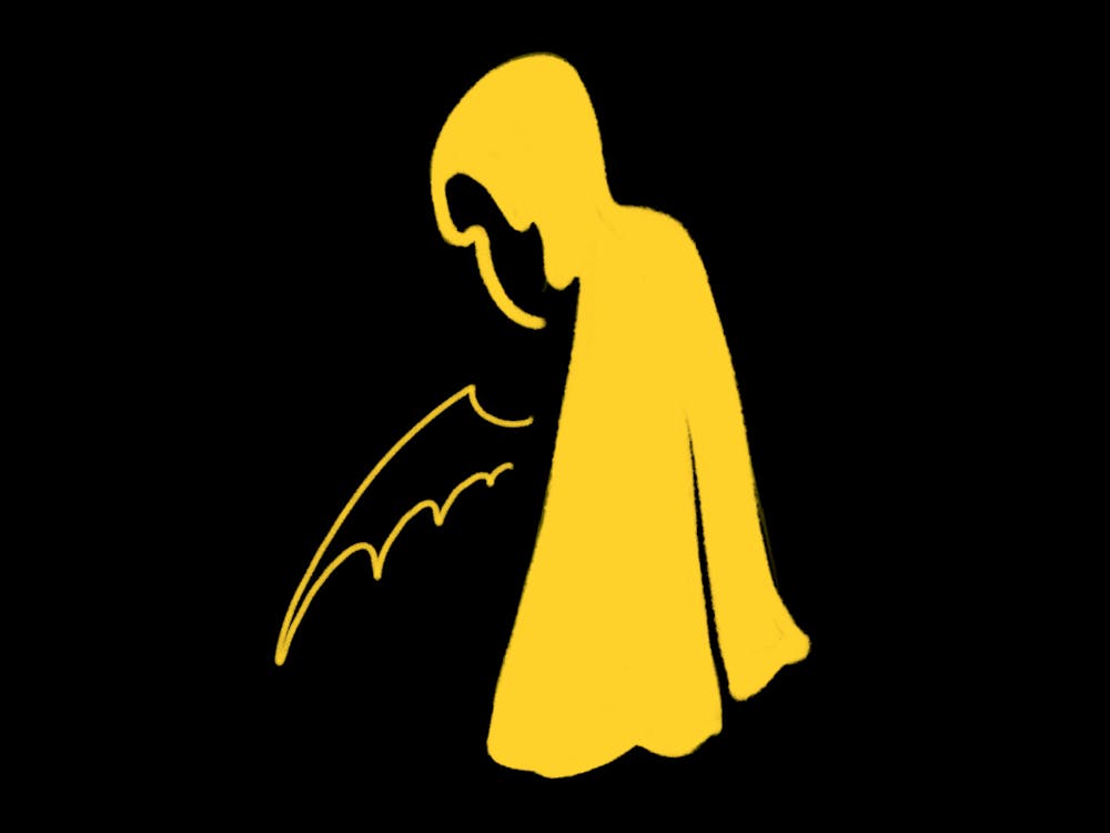 <p>A yellow silhouette of a figure with a hood and wings is set against a black background.</p>