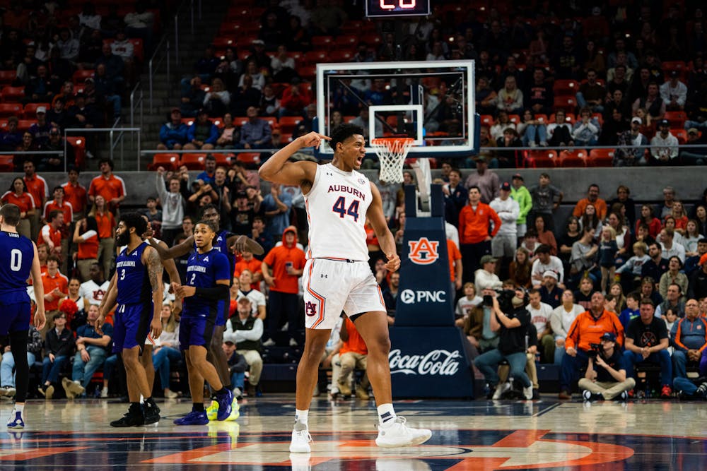 <p>Dec. 14, 2021; Dylan Cardwell (44) celebrates during a game against North Alabama from Auburn Arena in Auburn, Ala.</p>