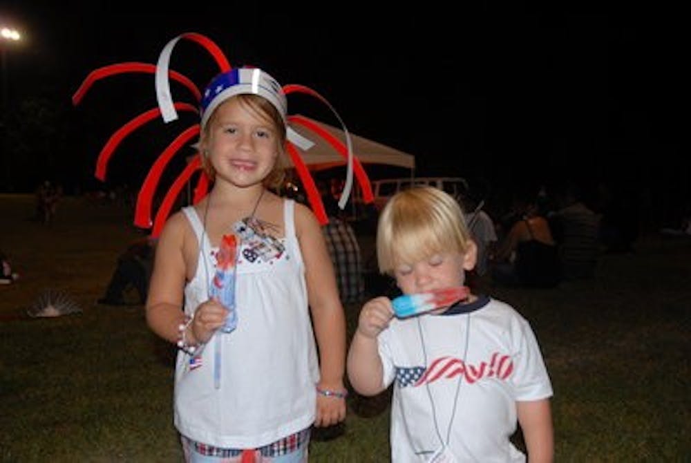 Local children enjoy free popsicles at Independence Day Celebration at Duck Samford Stadium July 4, 2010. (Contributed by Auburn City Parks and Recreation)