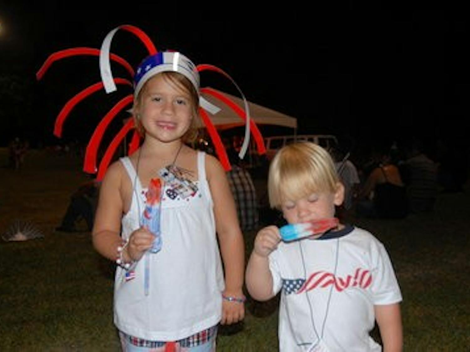 Local children enjoy free popsicles at Independence Day Celebration at Duck Samford Stadium July 4, 2010. (Contributed by Auburn City Parks and Recreation)