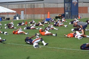 The Tigers stretch at practice on August 6. (Danielle Lowe / PHOTO EDITOR)