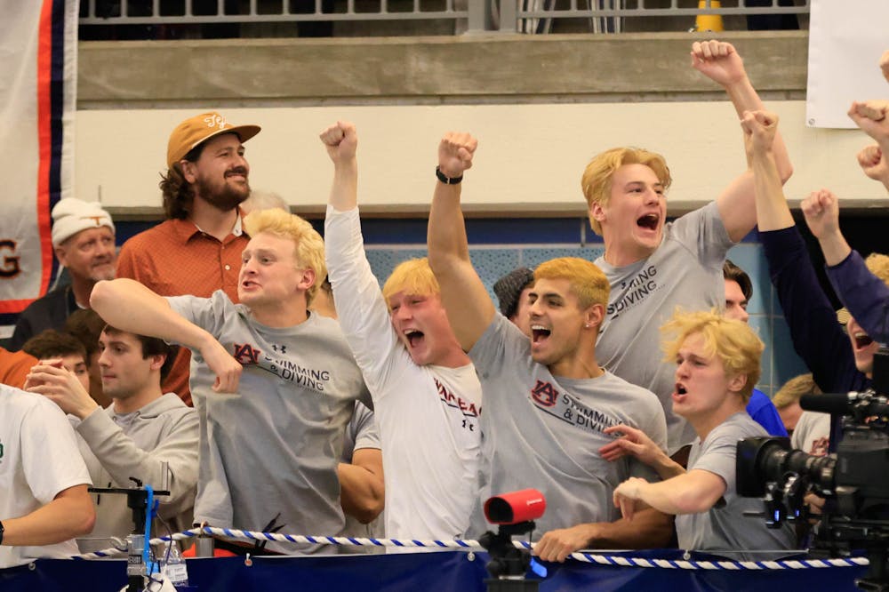 <p>The Auburn swim and dive team celebrates.</p>