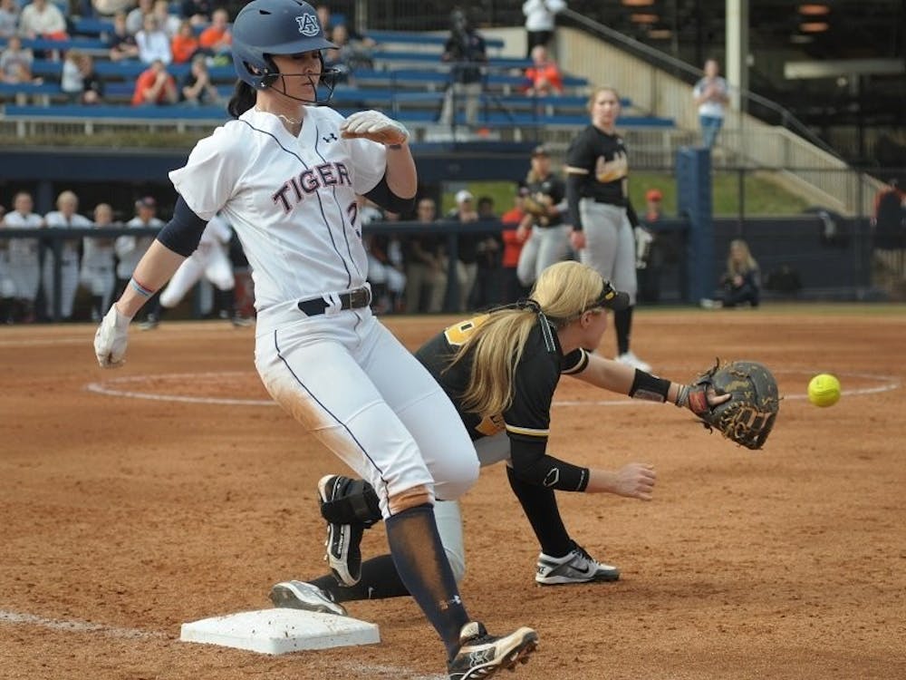 <p>Haley Fagan #2 beats out a throw to first base for a single. Auburn vs Appalacian State in Auburn, AL on Feb. 8, 2015. Adam Sparks | Photographer.</p>