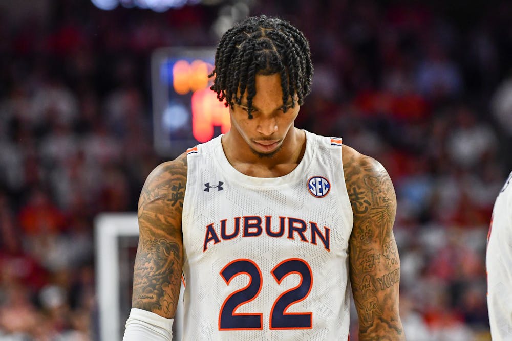 Auburn guard Allen Flanigan (22) walks down the court during a matchup against Alabama in Neville Arena on Feb. 11, 2023.
