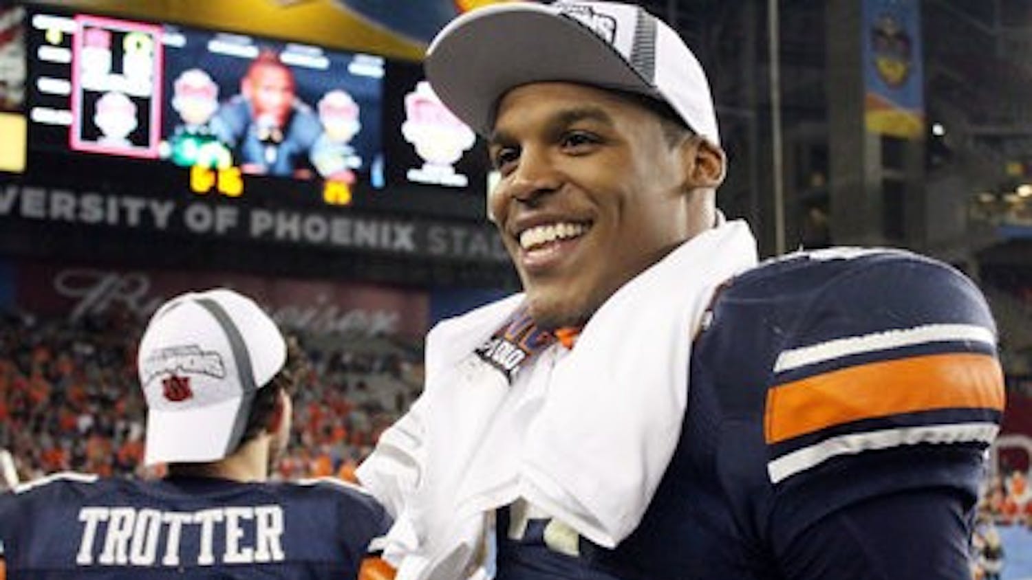 Cam Newton smiles as he celebrates the Auburn victory. (File photo)