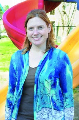 Laura Perry, teacher at The Little Tree preschool, helps autistic students by analyzing their behavior. (Christen Harned / ASSISTANT PHOTO EDITOR)