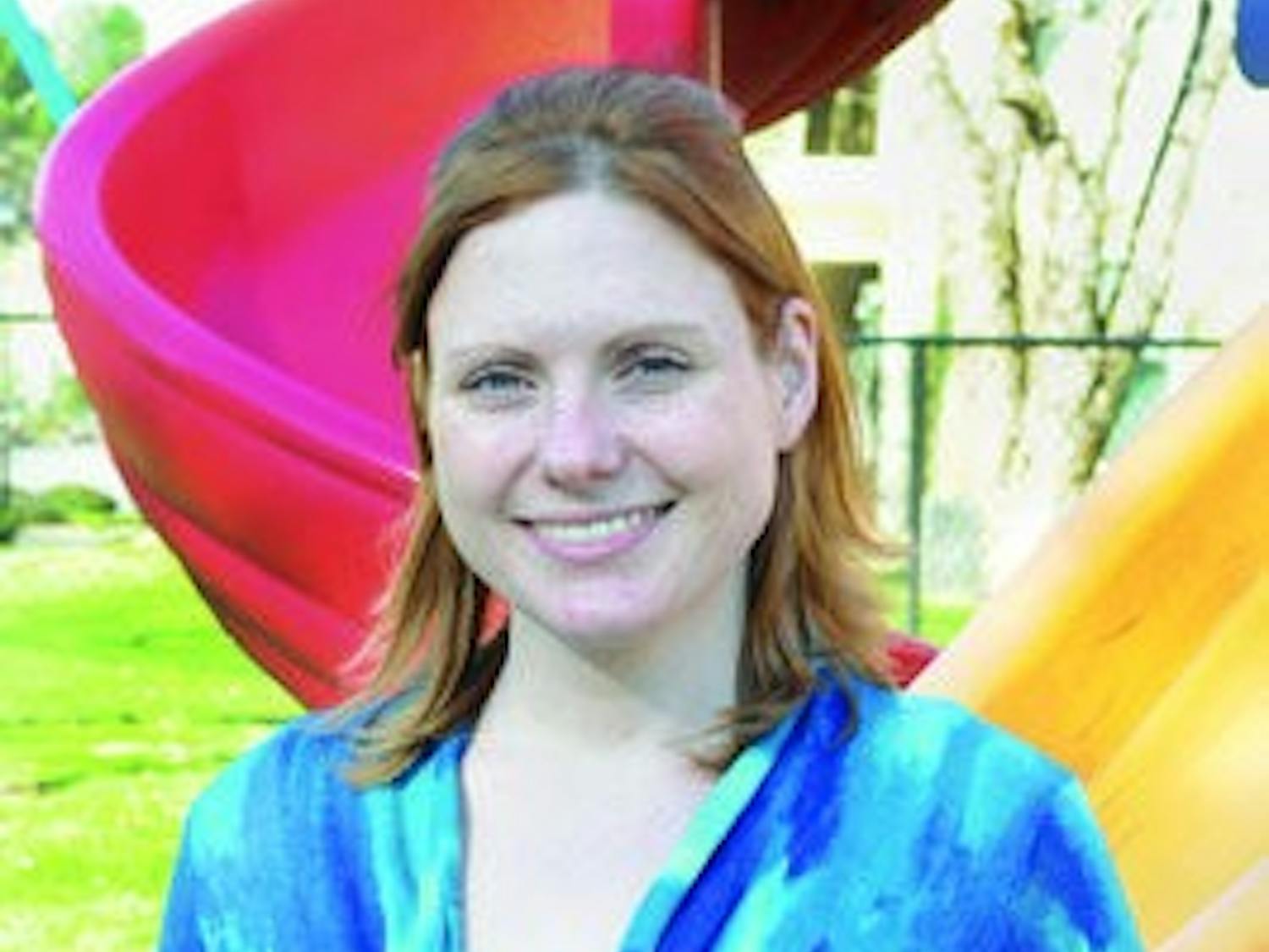 Laura Perry, teacher at The Little Tree preschool, helps autistic students by analyzing their behavior. (Christen Harned / ASSISTANT PHOTO EDITOR)