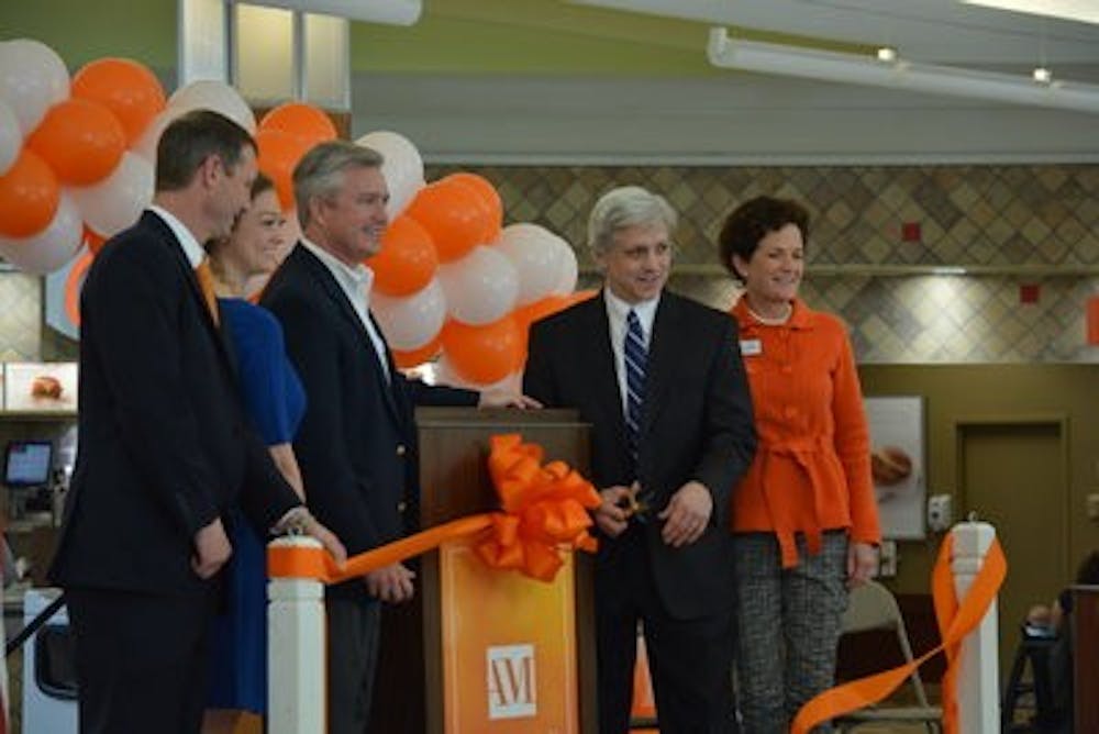 Mayor of Pro Tempore Ron Anders cuts the ribbon celebrating the re-opening. (Kris Sims | Multimedia Editor)