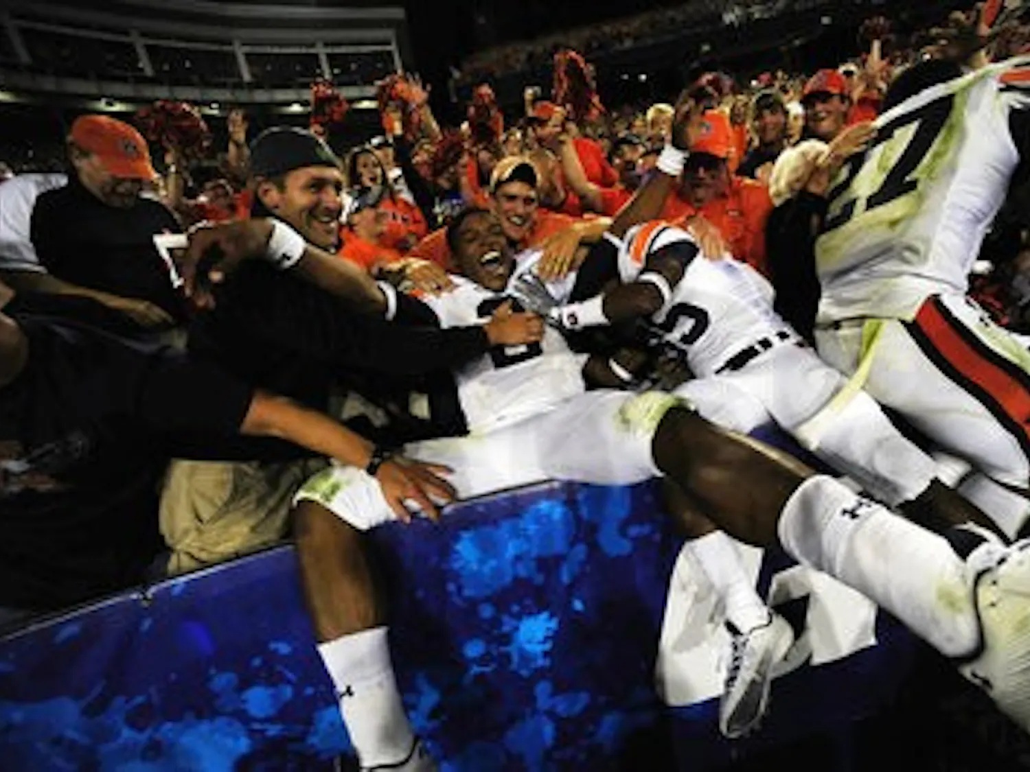 Cam Newton celebrates with fans. (Todd Van Emst / Auburn Media Relations)