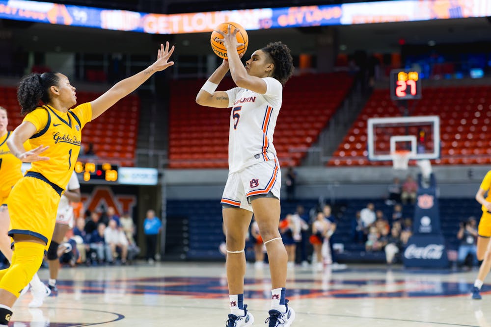 Auburn guard Sydney Shaw (5) takes a shot against California on November 17, 2023 in Neville Arena. 