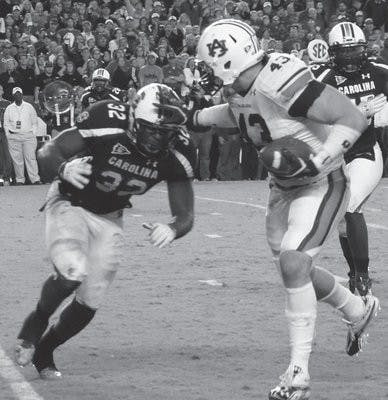 Philip Lutzenkirchen fights his way to a touchdown against South Carolina on Oct. 1, 2011. Lutzenkirchen has been named to the 2012 John Mackey Award watch list. (Robert E. Lee / EDITOR-IN-CHIEF)