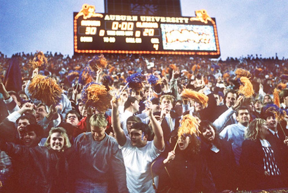<p>Auburn fans celebrate their 30-20 victory over Alabama in the Iron Bowl at Jordan-Hare Stadium on Dec. 2, 1989. (Birmingham News file photo by Steve Barnette)</p>