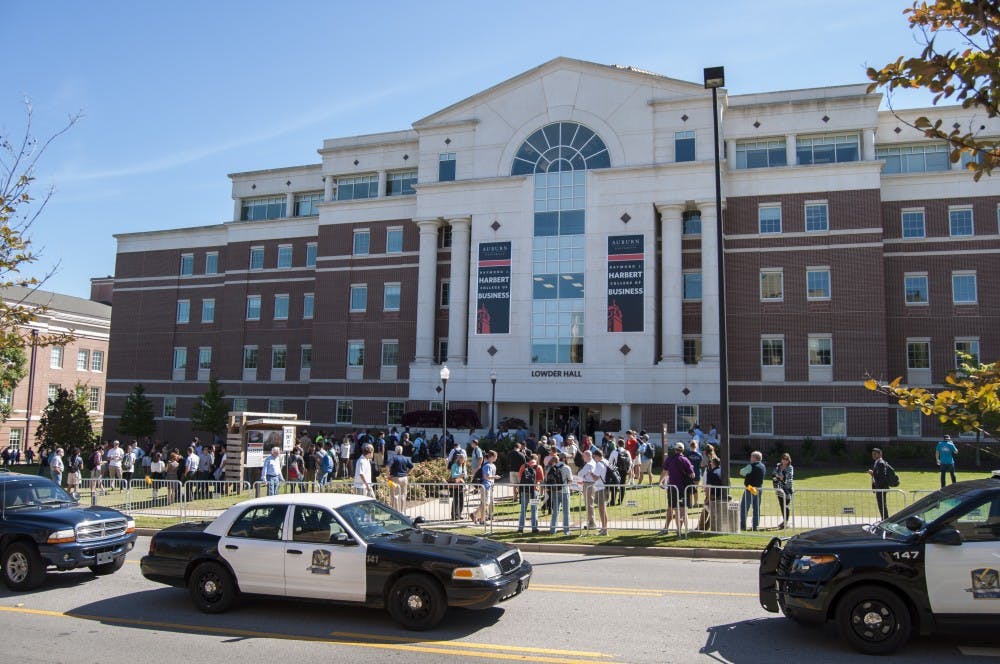 Students and professors wait outside Lowder Hall while police search the building on Oct. 6. (Jordan Hays | Managing Editor)