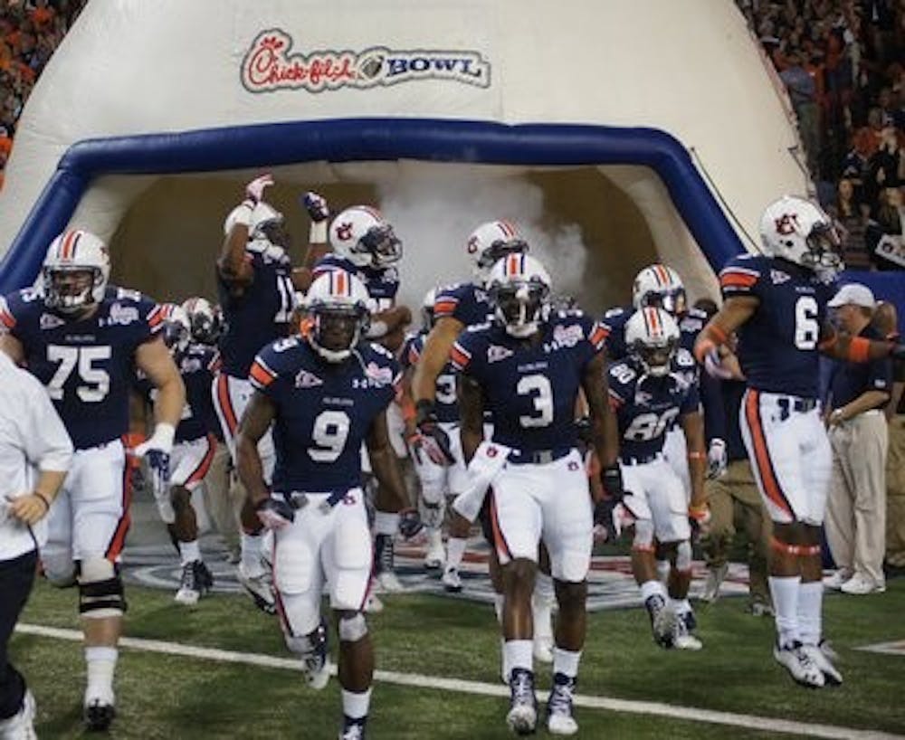 The Auburn Tigers rumble through the tunnel at the Georgia Dome at the 2011 Chick-fil-A Bowl. The Tigers return to the dome Saturday to face Clemson in the Chick-fil-A Kickoff Game. (Robert E. Lee / Editor-In-Chief)