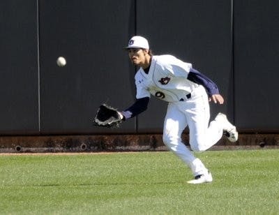 Auburn's Jackson Burgreen makes the catch in left field in the fifth inning against Maine on Sunday, Feb. 17. (Courtesy of Todd Van Emst)