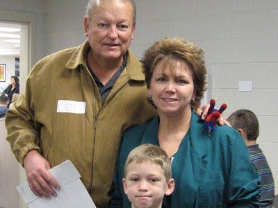 Allan, Patty and Will Kyzar cheer on Auburn from Pace, Florida.