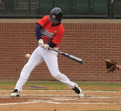Jackson Burgreen hits a home run for Auburn. (Courtesy of AUBURN ATHLETICS)