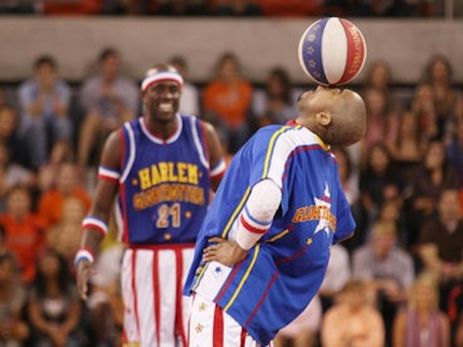 Harlem Globetrotter Scooter Christensen balances a ball on his nose at the opening of the Auburn Arena. (Photos by Emily Adams / Photo Editor)