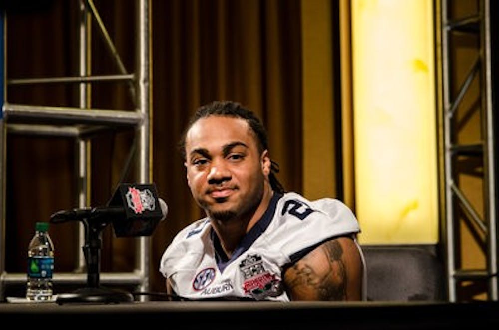 Auburn running back Tre Mason talks to reporters during Saturday's BCS National Championship Game Media Day.
(Raye May / DESIGN EDITOR)