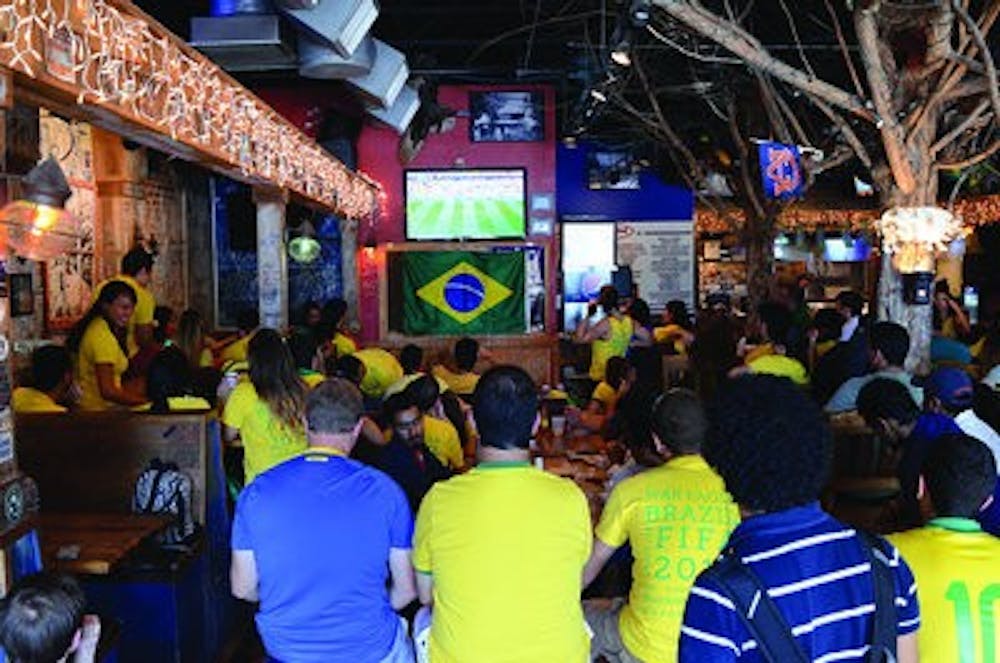 Brazil fans gather in Moe's Original Bar B Que for a match against Mexico. (Photo by Raye May | Photo & Design Editor)