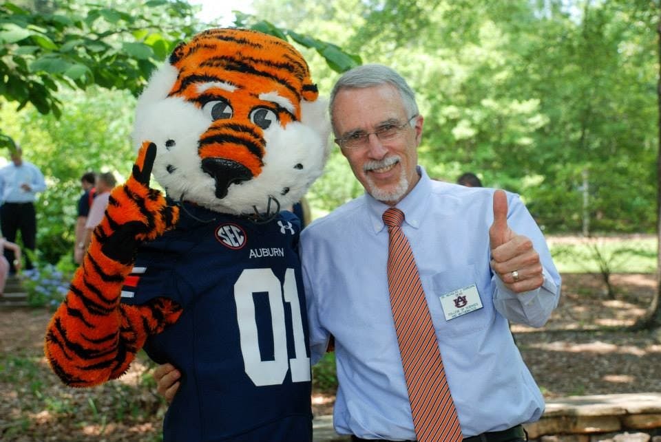 COSAM Dean Nicholas Giordano gives a thumbs-up with Aubie.