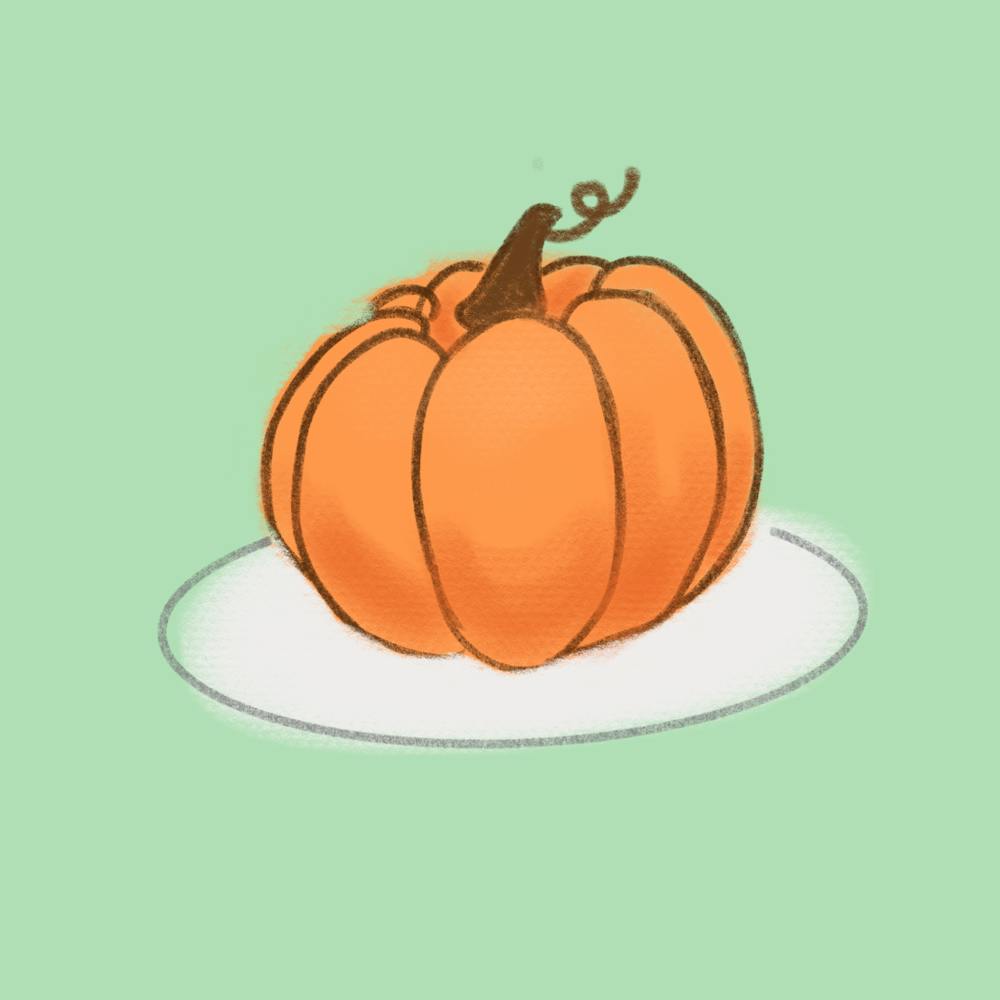 <p>Pumpkin sitting on a plate.</p>