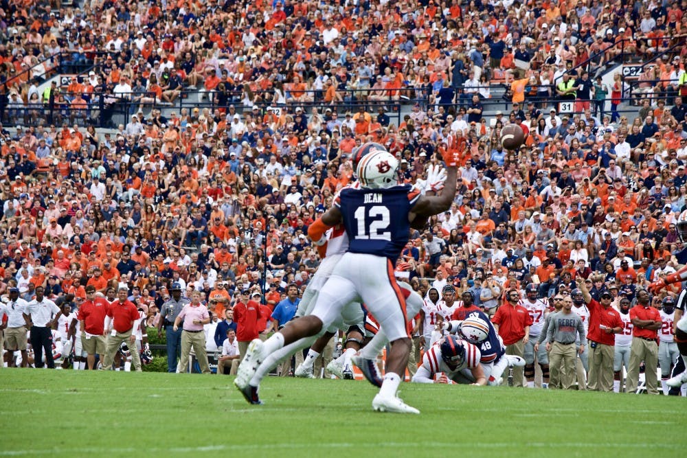 Jamel Dean (12)&nbsp;reaches to swat the ball&nbsp;out of the air. Auburn vs Ole Miss on Saturday, Oct. 7 in Auburn, Ala.