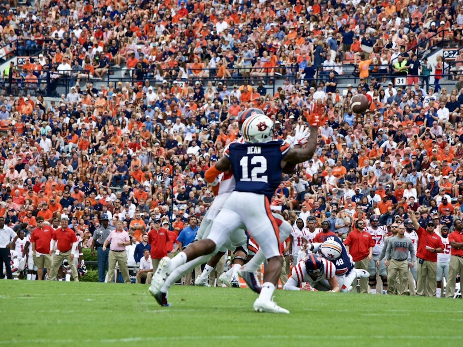 Jamel Dean (12) reaches to swat the ball out of the air. Auburn vs Ole Miss on Saturday, Oct. 7 in Auburn, Ala.