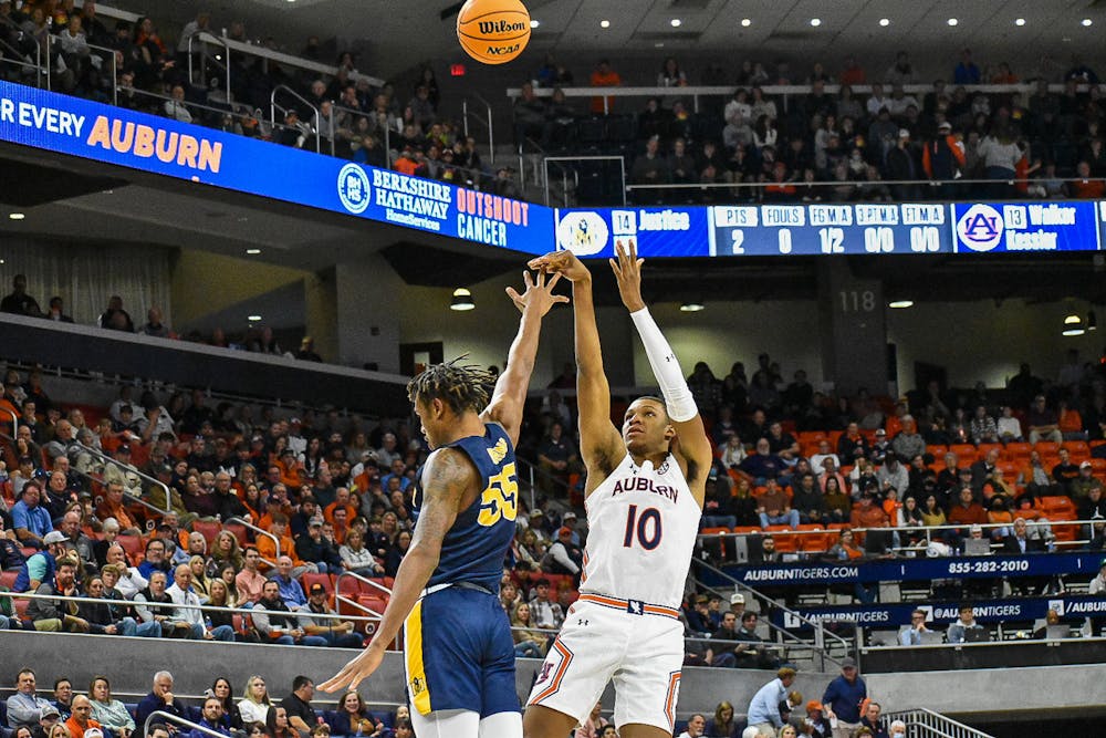 December 22, 2021; Auburn, Alabama; Jabari Smith Jr. (10) shoots a contested jumper over a defender in a match between Auburn and Murray State in the Auburn Arena.