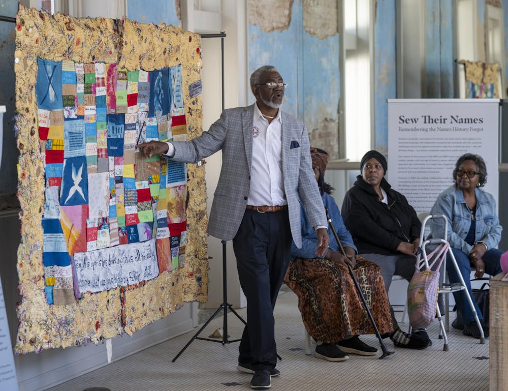 <p>Reverend Dale Braxton at a workshop in Hale County, Alabama, for the "Sew Their Names" project.</p>