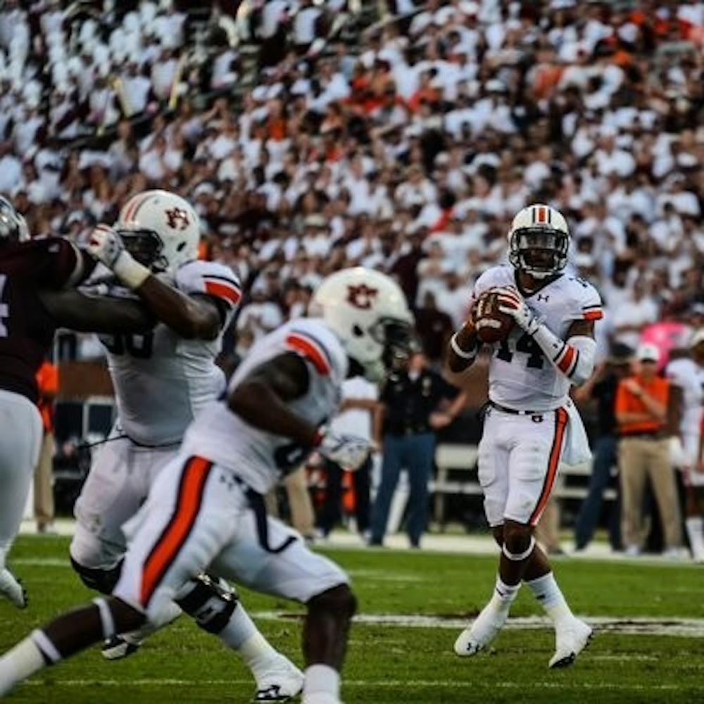 Nick Marshall looking for an open receiver. (Raye May | Photo Editor)