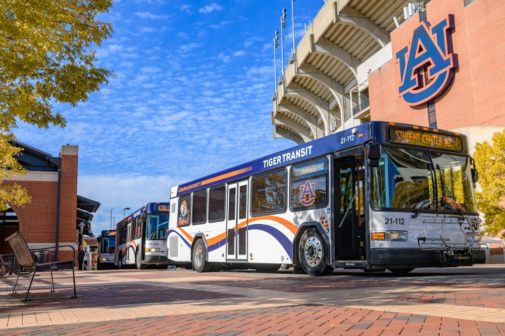 <p>Tiger Transit buses approach the Melton Student Center.</p>