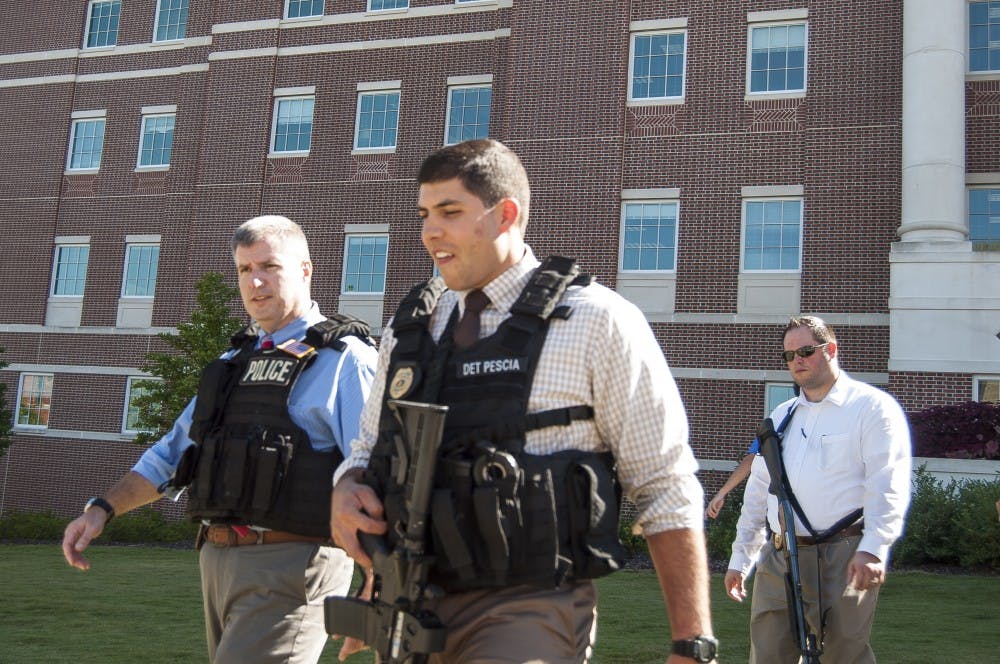 Armed detectives leaving Lowder Hall after the scene was determined to be safe on Oct. 6. (Jordan Hays | Managing Editor)