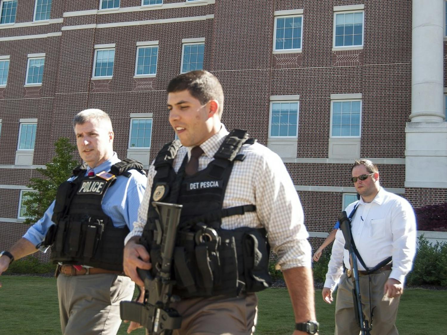 Armed detectives leaving Lowder Hall after the scene was determined to be safe on Oct. 6. (Jordan Hays | Managing Editor)