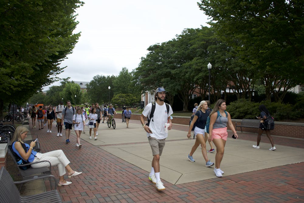 Students walk down the Haley Concourse on Aug. 16, 2021, the first day of fall classes at Auburn University.